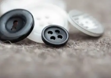 Black and white polyester buttons