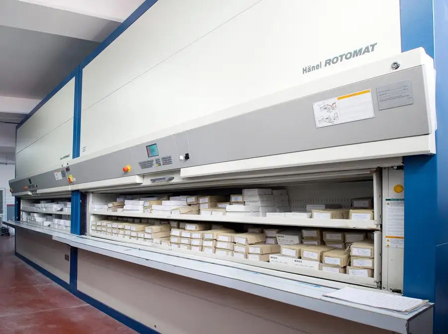 An automated storage system with boxes of buttons